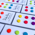 Sets of mix and match colourful small round handmade studs with linear pattern on cards with 'Studio Nerg' branding.